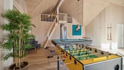 a room with a ping pong table in the middle at Villavilla 176 - Vrist, Vestjylland in Harboør