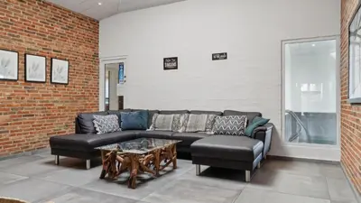 a living room with a couch and a table at Villavilla 607 - Vorupør, Nordjylland in Thisted