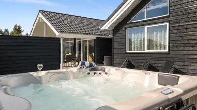 a hot tub in the backyard of a house at Villavilla 547 - Hostrup Strand, Limfjorden in Spottrup