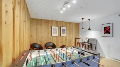 a ping pong table in a room with wooden walls at Villavilla 373 - Glyngøre, Limfjorden in Roslev