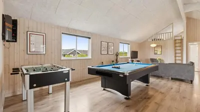 a large room with a pool table in it at Villavilla 404 - Hostrup Strand, Limfjorden in Spottrup