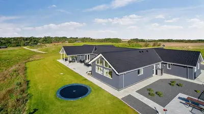 an overhead view of a house with a backyard at Villavilla 431 - Hostrup Strand, Limfjorden in Spottrup