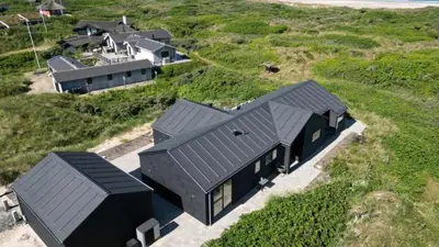 an overhead view of a black house on a hill at Villavilla 514 - Grønhøj, Nordjylland in Løkken