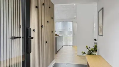 a hallway with a door leading to a kitchen at Villavilla 683 - Blokhus, Nordjylland in Saltum