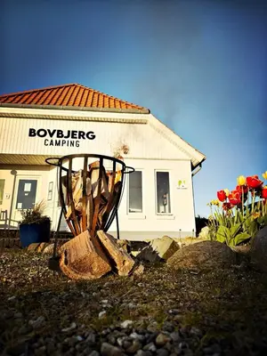 a building with a sign that says boykergency camping at Bovbjerg Camping in Lemvig