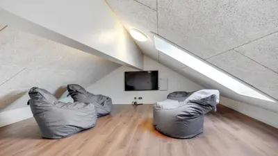 two people in inflatable chairs sitting in a room at Villavilla 546 - Hostrup Strand, Limfjorden in Spottrup