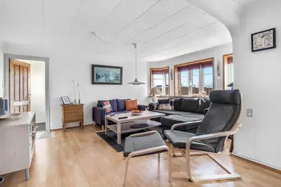 a living room with a couch and a table at 730-Thyboron-Manovej-9 in Thyborøn