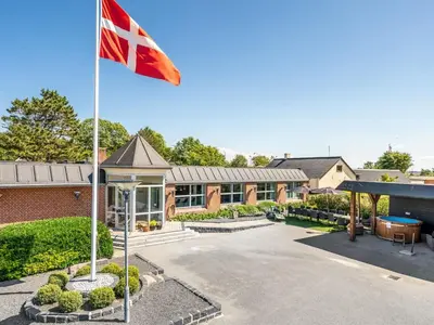 a british flag flying in front of a building at Holiday Home Borjana - 500m to the fjord by Interhome in Fur