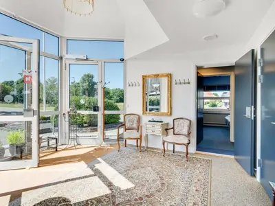 a room with two chairs and a desk with a mirror at Holiday Home Borjana - 500m to the fjord by Interhome in Fur