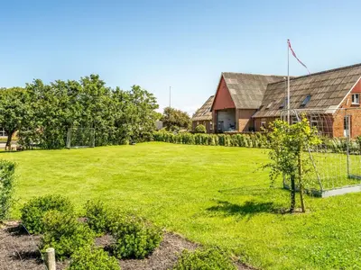 a large yard with a fence and a house at Holiday Home Borjana - 500m to the fjord by Interhome in Fur