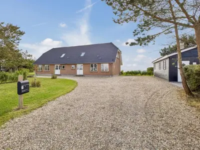 a house with a driveway in front of it at Holiday Home Fridhild - 150m to the fjord by Interhome in Redsted