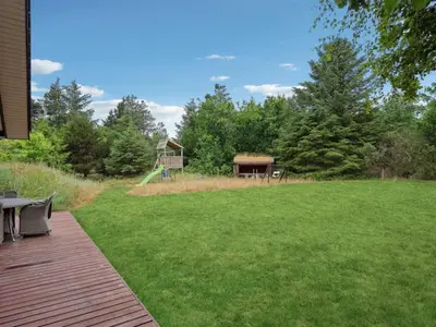 a large yard with a playground and a gazebo at Holiday Home Muriel - 1-6km from the sea by Interhome in Blokhus