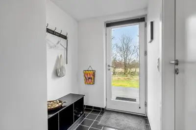 a kitchen with a black counter and a window at JB374-Brovst-Kronvildtvej-222 in Tranum Strand