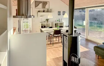 a kitchen and dining room with a stove in a house at 3 Bedroom Amazing Home In Brovst in Brovst