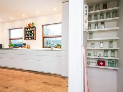 a kitchen with white cabinets and a window at 4 star holiday home in Viborg in Viborg