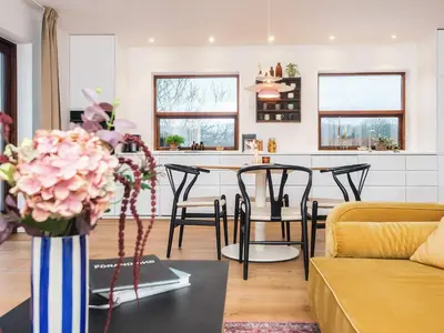 a living room with a vase of flowers on a table at 4 star holiday home in Viborg in Viborg