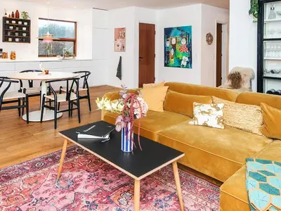 a living room with a couch and a table at 4 star holiday home in Viborg in Viborg