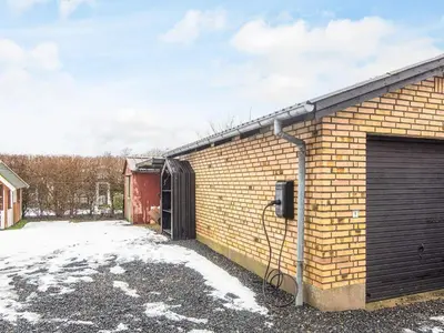 a brick building with a door and a garage at 4 star holiday home in Viborg in Viborg