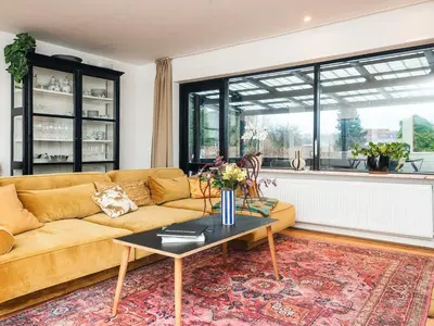 a living room with a couch and a table at 4 star holiday home in Viborg in Viborg