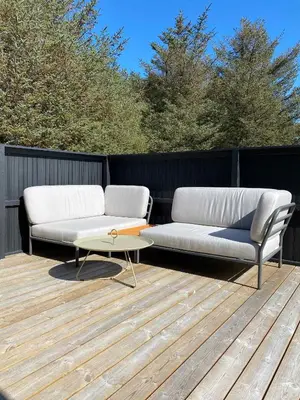 two couches and a coffee table on a deck at Peaceful Base Near Beach And Nature in Saltum