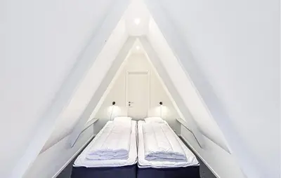 a loft bed with two beds in a room at Awesome Home In Farsø With Wifi in Farsø
