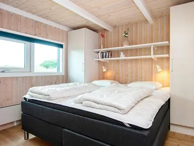 a bedroom with two beds in a room at 4 star holiday home in Løkken in Løkken