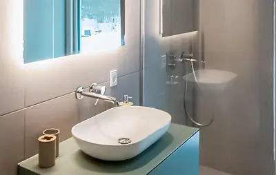 a bathroom with a white sink and a shower at Nice Home In Skals With Wifi in Skals