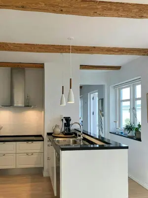 a kitchen with a sink and a counter top at Restored Fisherman's House On Cliff In Thy in Hanstholm