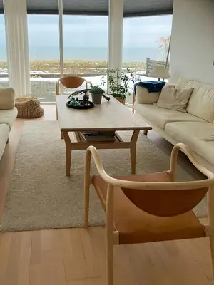 a living room with a couch and a coffee table at Restored Fisherman's House On Cliff In Thy in Hanstholm