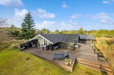 an overhead view of a house with a wooden deck at BL1155-Blokhus-Berberisvej-74 in Blokhus