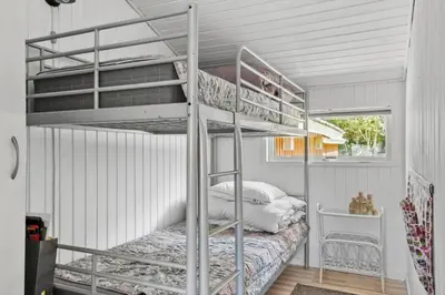 a bedroom with two bunk beds in a room at JB381-Fjerritslev-Ahornvej-65