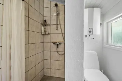a bathroom with a shower with a toilet at JB381-Fjerritslev-Ahornvej-65