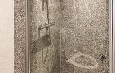 a shower with a glass door with a toilet at Nice Home In Løgstrup With Wifi in Løgstrup