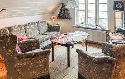 a living room with a couch and a table at Nice Home In Løgstrup With Wifi in Løgstrup