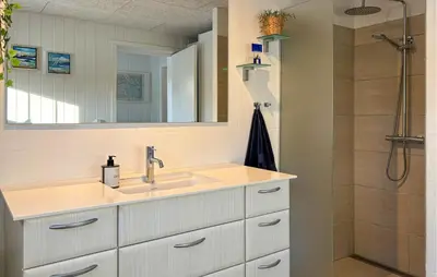 a bathroom with a sink and a shower at 3 Bedroom Awesome Home In Farsø in Farsø