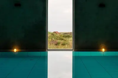 a room with a window and a view of the ocean at Feriecenter Slettestrand in Fjerritslev