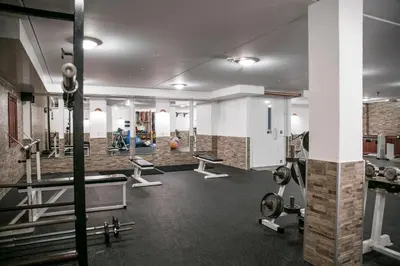 a gym with several treadmills and machines at Feriecenter Slettestrand in Fjerritslev