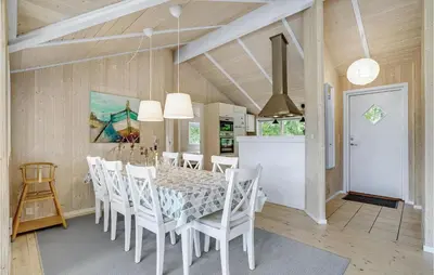 a kitchen and dining room with a table and chairs at Holiday Home Vemb With Fireplace 07 in Vemb