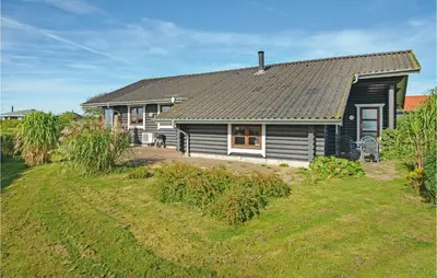 a house with a large yard in front of it at Holiday Home Vinderup With Fireplace 07 in Vinderup