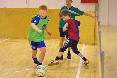 a group of young boys playing a game of soccer at Roslev Vandrerhjem-Hostel in Roslev