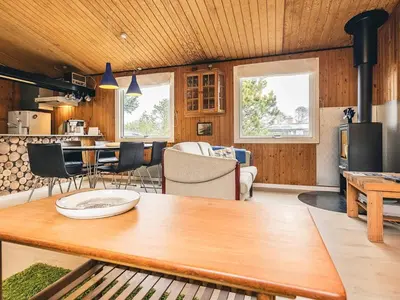 a kitchen and living room with a wooden ceiling at 6 person holiday home in Thisted-By Traum in Sønder Vorupør