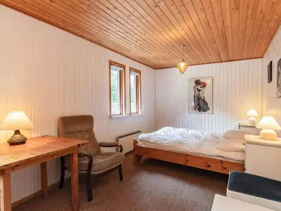 a bedroom with a bed and a wooden ceiling at 5 person holiday home in Roslev-By Traum in Sønder Thise