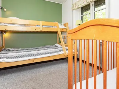 two bunk beds are in a room with at 19 person holiday home in Løgstør-By Traum in Trend