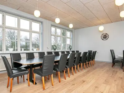 a conference room with a table and chairs at 26 person holiday home in Roslev-By Traum in Åsted