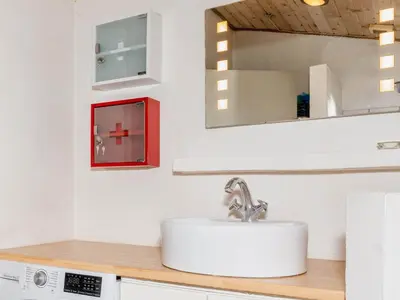 a bathroom with a sink and a mirror at 6 person holiday home in Vestervig-By Traum in Vestervig