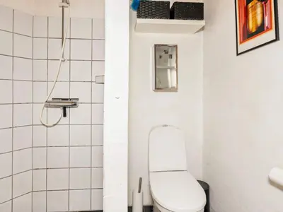 a small bathroom with a toilet and a shower at 6 person holiday home in Vestervig-By Traum in Vestervig