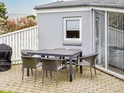 a black table and chairs on a patio at 6 person holiday home in Vestervig-By Traum in Vestervig
