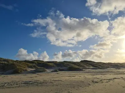 a view of a sandy beach with a cloudy sky at 6 person holiday home in Saltum-By Traum in Saltum