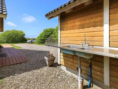 a kitchen sink attached to the side of a house at 6 person holiday home in Vestervig-By Traum in Vestervig