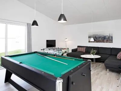 a living room with a pool table at Luxury Spa Retreat by Sea in Vrist